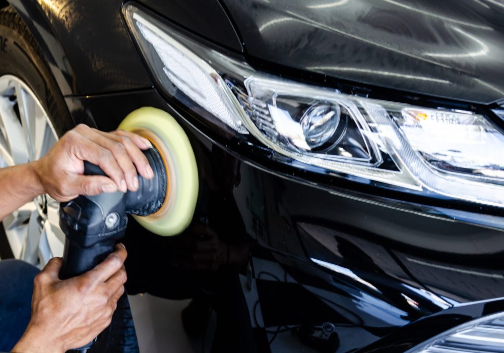 Car detailing.Man hand holding and polish the car.